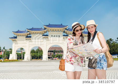 Girls looking the map in Taipei attraction 38510797