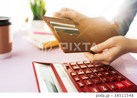 woman is holding purse, credit card in hands and 38511548