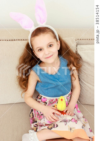 Cute little child wearing bunny ears on Easter day Cute little child wearing bunny ears on Easter day 38514154