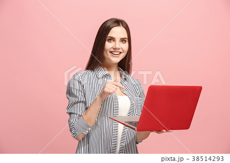 Businesswoman with laptop on pink studio 38514293