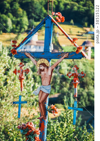 Solitary traditional cross symbol in the mountains Solitary traditional cross symbol in the mountains 38515122