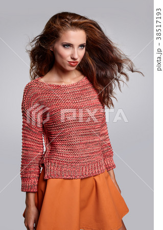 Beautiful brunette woman portrait in autumn color. Studio shoot 38517193