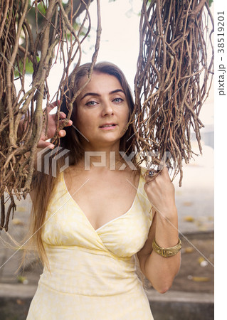 portrait of a woman near a banyan tree portrait of a woman near a banyan tree 38519201