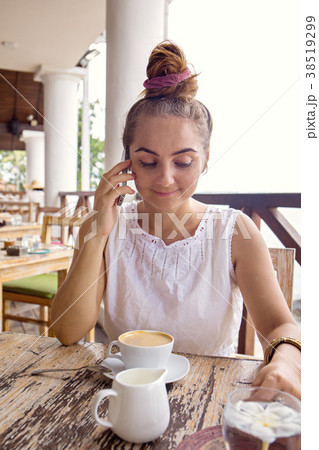 Woman talking on smartphone Woman talking on smartphone 38519299