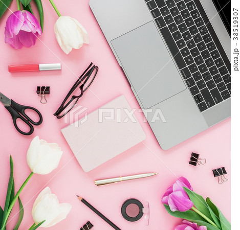 Workspace with laptop, tulips flowers, accessories 38519307