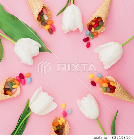Frame of colorful bright candy in waffle cones 38519310