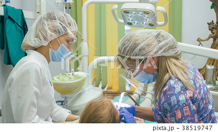 Child with a mother at a dentist's reception. The Child with a mother at a dentist's reception. The 38519747