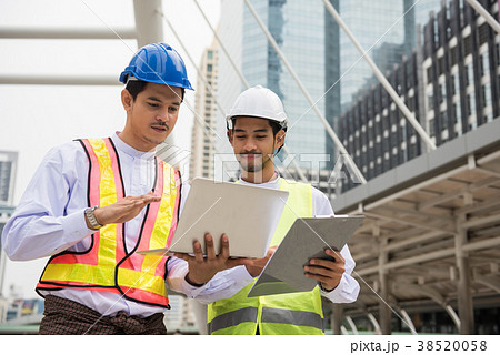 Handsome Myanmar engineer working in city 38520058