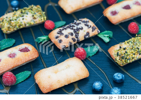 Vegan cakes decorated with mint and berries. 38521667