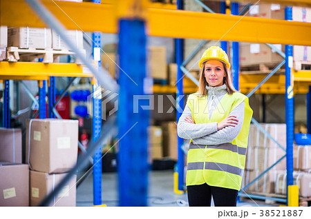 Portrait of a young woman warehouse worker. 38521887
