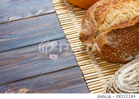 assortment of baked bread on wood table. top view assortment of baked bread on wood table. top view 38522184