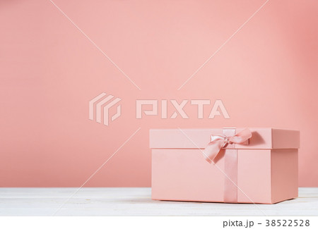 Pink gift box on pink background 38522528