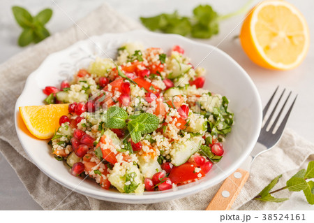 Tabbouleh salad with tomato, cucumber, couscous Tabbouleh salad with tomato, cucumber, couscous 38524161