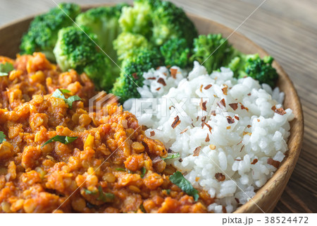 Bowl of red lentil curry with white rice Bowl of red lentil curry with white rice 38524472