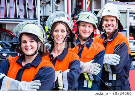 Four fire fighters doing thumbs up 38524660