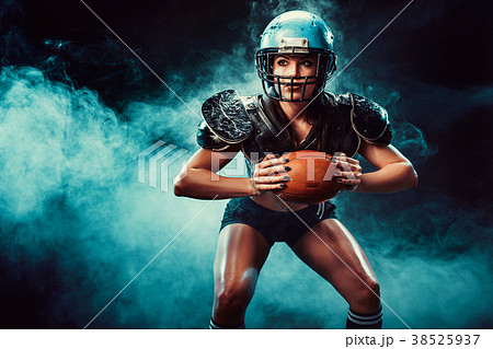 Competitive woman with rugby ball Competitive woman with rugby ball 38525937