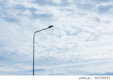 street lamp pole light against white clouds sky street lamp pole light against white clouds sky 38526693