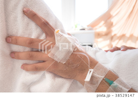 IV drip in patient's hand 38529147