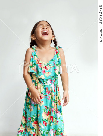 cute asian kids girl screaming or laugh action on white backgrou cute asian kids girl screaming or laugh action on white backgrou 38532739