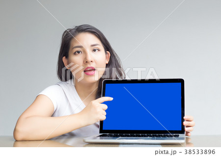 asian woman point to blank laptop screen to display asian woman point to blank laptop screen to display 38533896