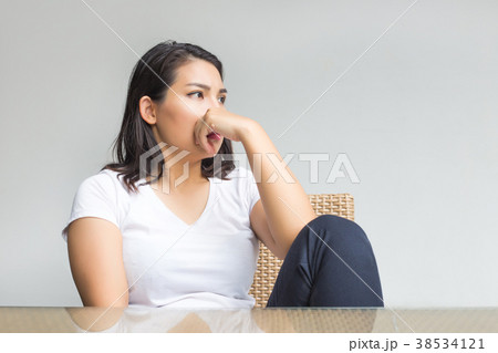 thinking asian woman siting on chair and table thinking asian woman siting on chair and table 38534121