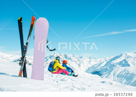 Photo of snowboard, skis on background of sitting 38537298