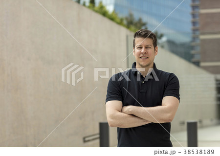 Portrait of Man Near Office Buildings 38538189