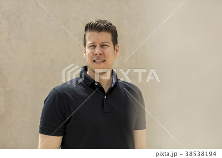 Model Portrait Pose in Front of Outdoor Beige Wall Model Portrait Pose in Front of Outdoor Beige Wall 38538194