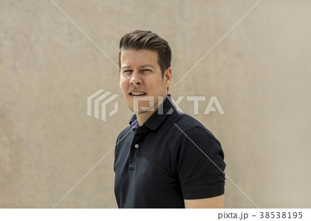 Model Portrait Pose in Front of Outdoor Beige Wall Model Portrait Pose in Front of Outdoor Beige Wall 38538195