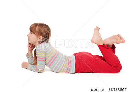 Child girl lying on the floor looking forward 38538665