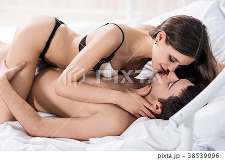 Young passionate couple making love in bed. 38539096