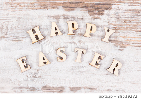 Inscription Happy Easter on rustic board Inscription Happy Easter on rustic board 38539272