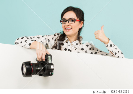 Young woman with camera 38542235