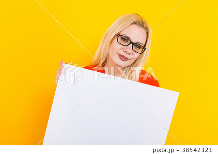 Blonde woman in dress with blank paper 38542321