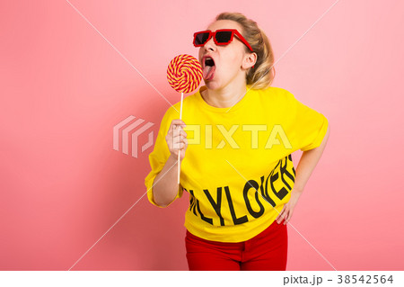 Young attractive womal with lollipop 38542564