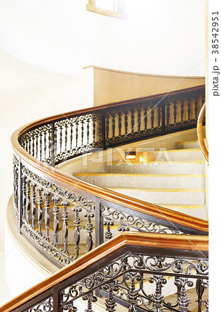 お洒落な洋館の螺旋階段と素敵な手すりの写真素材