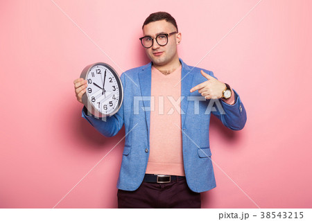 Handsome man in bright jacket with clocks Handsome man in bright jacket with clocks 38543215