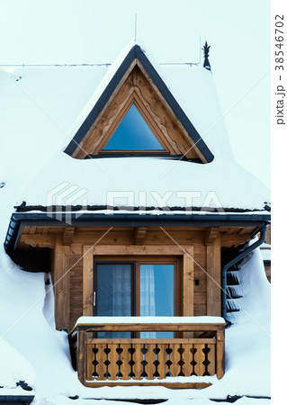 view of the window of a wooden house covered with snow view of the window of a wooden house covered with snow 38546702