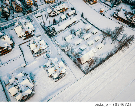 view from the drone on the roofs of a small village in winter view from the drone on the roofs of a small village in winter 38546722