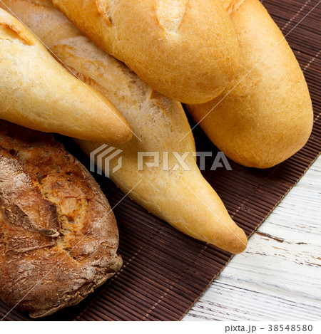 Freshly baked French baguettes on white table 38548580