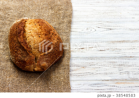 Fresh bread on wooden table. Top view 38548583