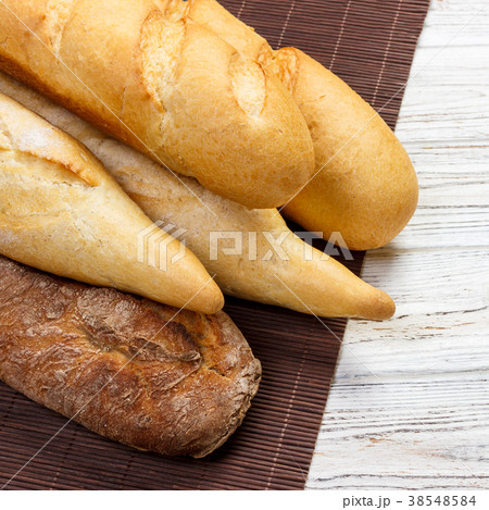Assortment of fresh French baguettes Assortment of fresh French baguettes 38548584