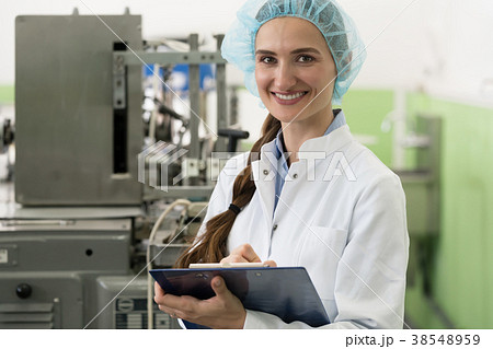 Portrait of woman quality inspector during work in Portrait of woman quality inspector during work in 38548959