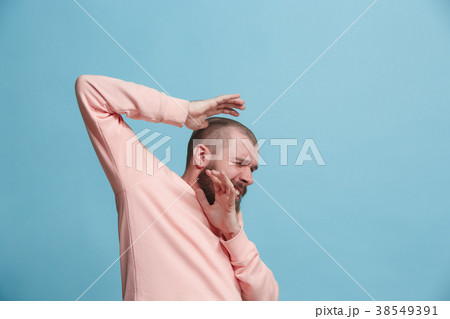 Portrait of the scared man on blue Portrait of the scared man on blue 38549391