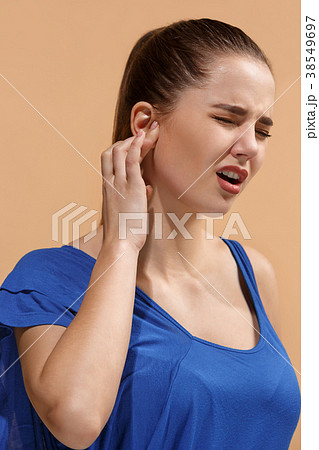 The Ear ache. The sad woman with headache or pain The Ear ache. The sad woman with headache or pain 38549697