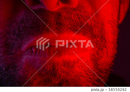 Macro closeup on man lips with sad facial expression 38550292