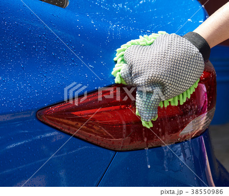 Washing blue car close-up 38550986