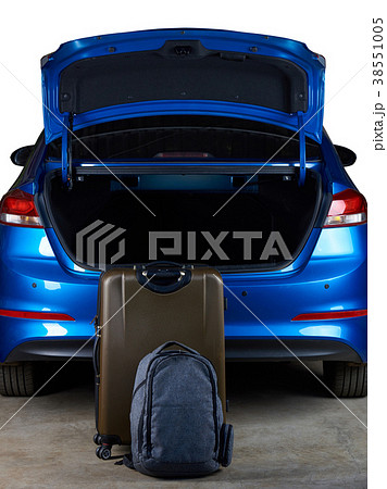 Luggage bags stand next to open car trunk Luggage bags stand next to open car trunk 38551005