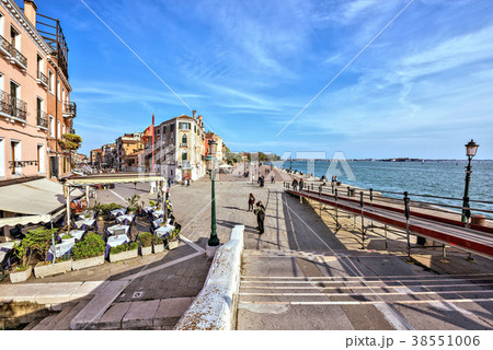 Daylight view from stairs to boardwalk with people Daylight view from stairs to boardwalk with people 38551006