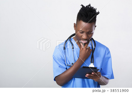 African-American doctor on a gray background African-American doctor on a gray background 38551900